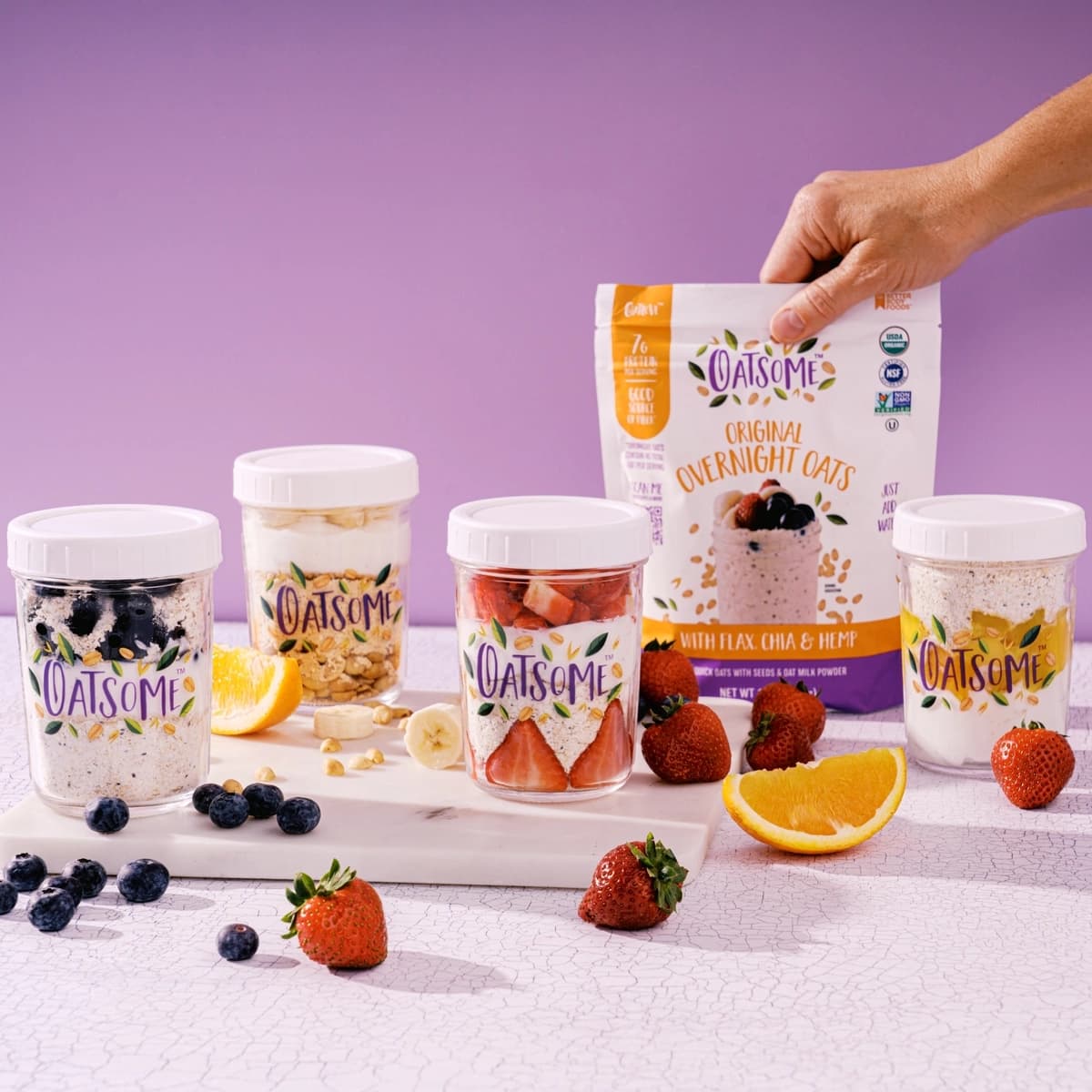 Overnight Oats product in jars with fruit and oats. 