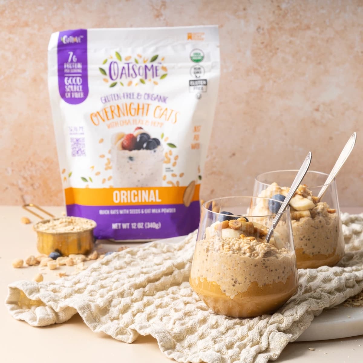 Overnight Oats product with almond butter, peanuts, and blueberrys